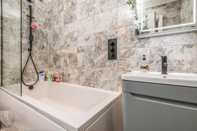 The family bathroom has been recently upgraded and is a modern space with a bath and shower.