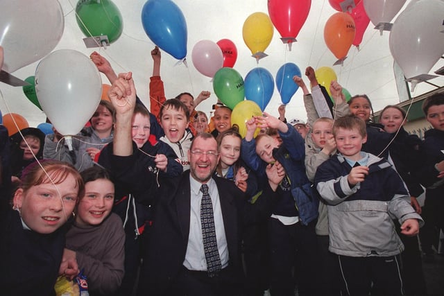 Leeds West MP John Battlegets ready for a balloon race at Holy Family RC Primary School in Armley in April 2001