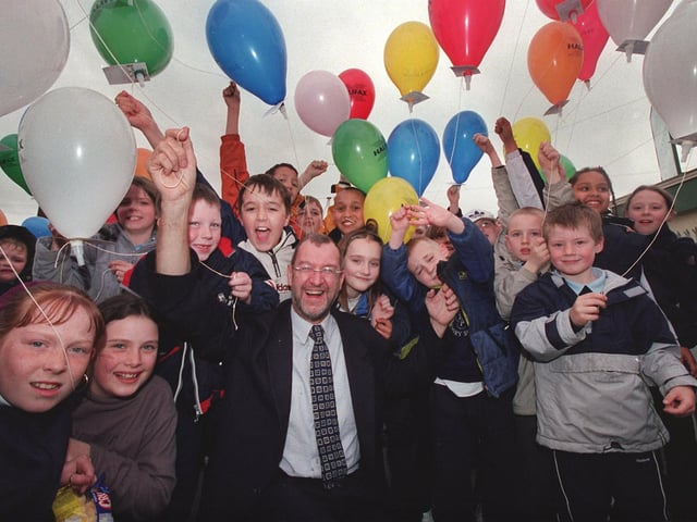 Leeds West MP John Battlegets ready for a balloon race at Holy Family RC Primary School in Armley in April 2001