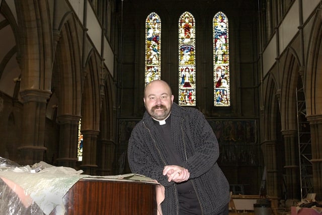Father Timothy Lipscomb inside St Bartholomew's Church which was undergoing major restoration work in December 2001.