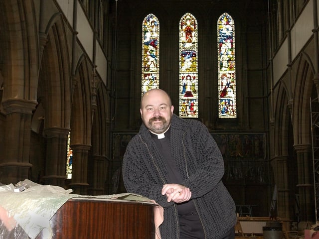 Father Timothy Lipscomb inside St Bartholomew's Church which was undergoing major restoration work in December 2001.