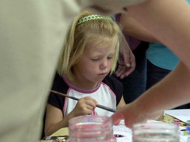 Armley Moor hosted a fun day for local youngsters in August 2001. Pictured painting is Cameron Waugh-Holton.