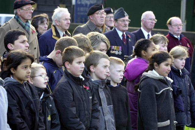 Armley Primary pupils watch intently during the remembrance service held by the school at the war memorial in Armley Park.