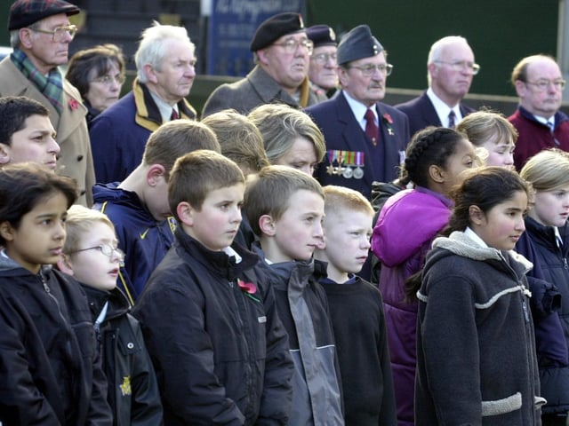 Armley Primary pupils watch intently during the remembrance service held by the school at the war memorial in Armley Park.