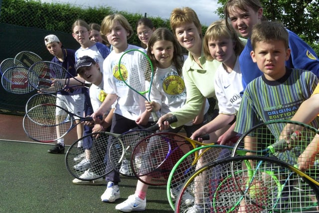 Assistant coach Gillian Pedder with some of the young tennis players at Upper Armley Tennis Club pictured in June 2001.