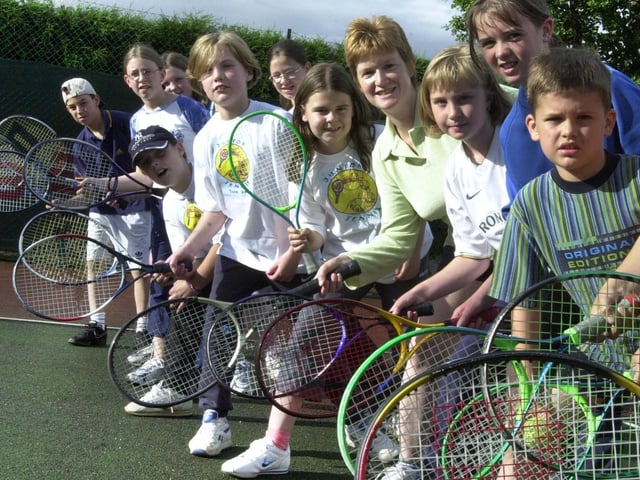 Assistant coach Gillian Pedder with some of the young tennis players at Upper Armley Tennis Club pictured in June 2001.