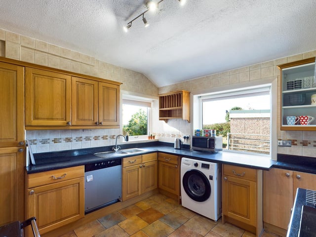 The fitted kitchen has a Range cooker.