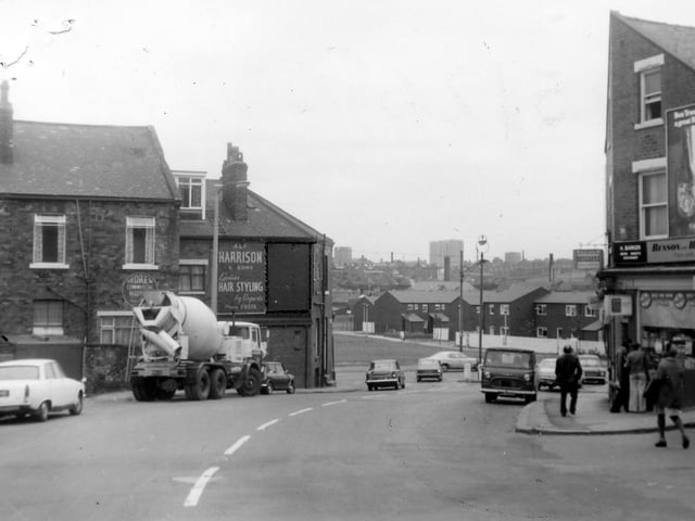 Looking south along Hyde Park Road/Woodsley Road towards Burley Road in August 1975. On the right, by the junction with Burley Lodge Terrace, is K. Barker, newsagent.