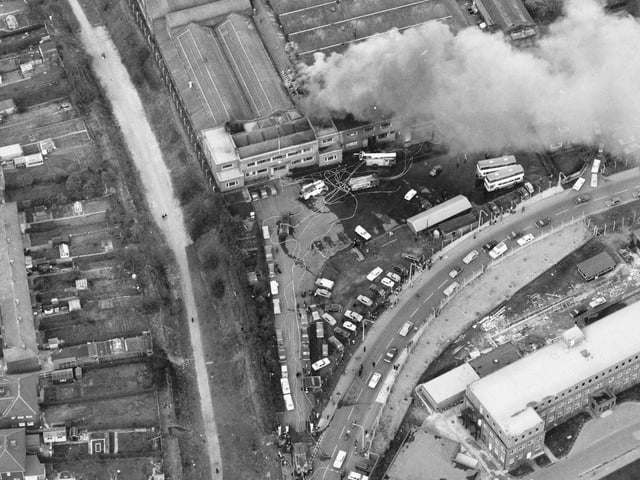 An aerial view of Cross Gates Carriage Works on Manston Lane, the firm of Charles H. Roe. A small fire in March 1975 is being attended to by several engines. Nine metro buses worth £120,000 each had to be pushed to safety.