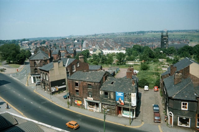 Looking down on Woodhouse taken from Leeds University Engineering Department in June 1975. Woodhouse Lane runs across in the foreground, with Spenceley Street on the right and Raglan Road leading off on the left. Volume One bookshop is seen in the centre in part of a block of derelict buildings due to be demolished.