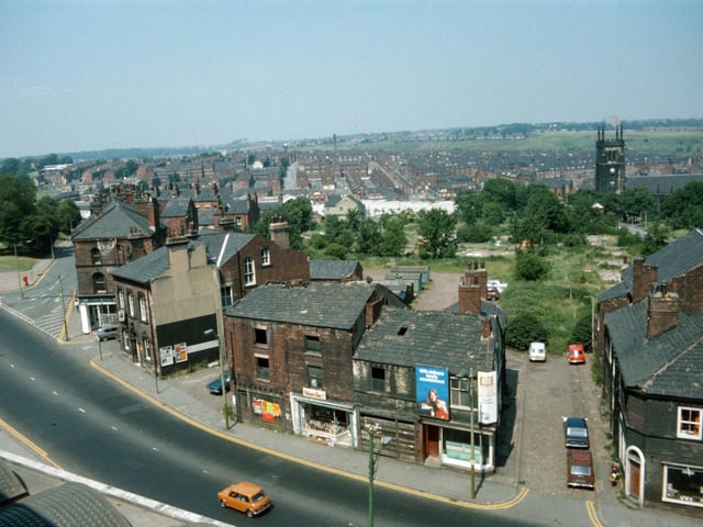 Looking down on Woodhouse taken from Leeds University Engineering Department in June 1975. Woodhouse Lane runs across in the foreground, with Spenceley Street on the right and Raglan Road leading off on the left. Volume One bookshop is seen in the centre in part of a block of derelict buildings due to be demolished.