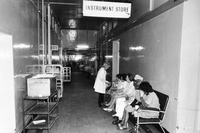 The queue waiting in the corridor outside Leeds General Infirmary's instrument store in January 1975.
