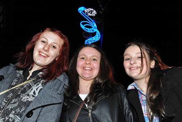 Wigan's Christmas Cracker town centre lights switch on 2011:  Chelsea Harrison, 12, left, Chloe Lee, 10, and Natasha Gaskell, 13, under the lights