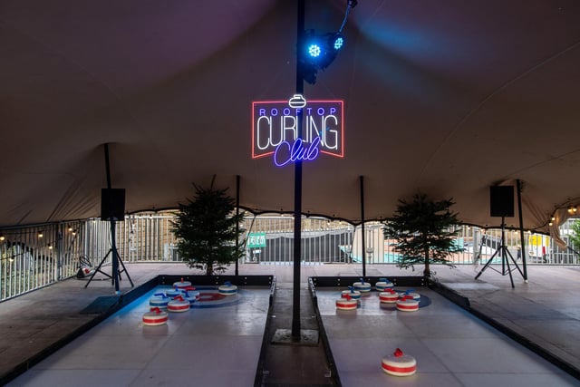 On the top floor is the rooftop curling club as well as a photo booth and beer pong.