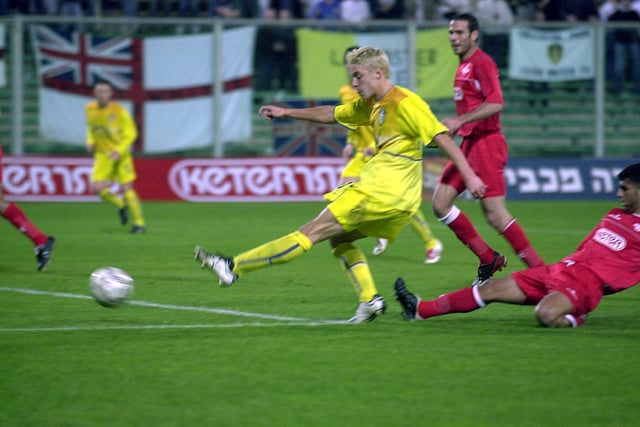 Alan Smith fires home his first goal.