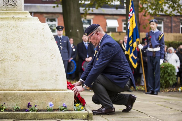 President of the Royal British Legion's Mirfield branch, David Horribin, lays a wreath