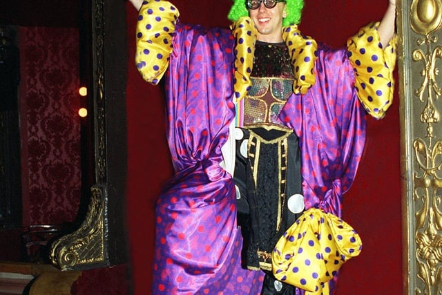 Rob Lines, the Marketing Assistant at Harrogate Theatre, modelling some of the pantomime costumes that were sold to the public. He is wearing Simple Simon's glasses and trousers  from Jack and the Beanstalk, Ebenezer's tunic from Aladdin, an Ugly Sister's dress from Cinderella and platform boots from many pantos.