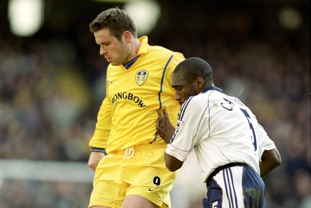 Mark Viduka is challenged by Tottenham Hotspur's Sol Campbell.