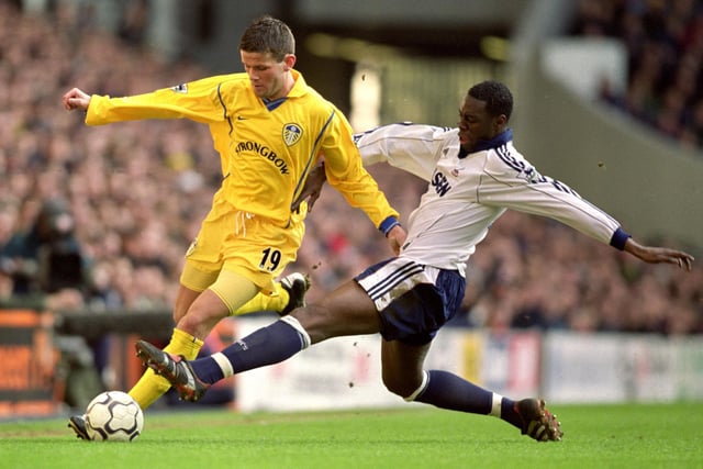 Eirik Bakke is challenged by Tottenham Hotspur's Ledley King.