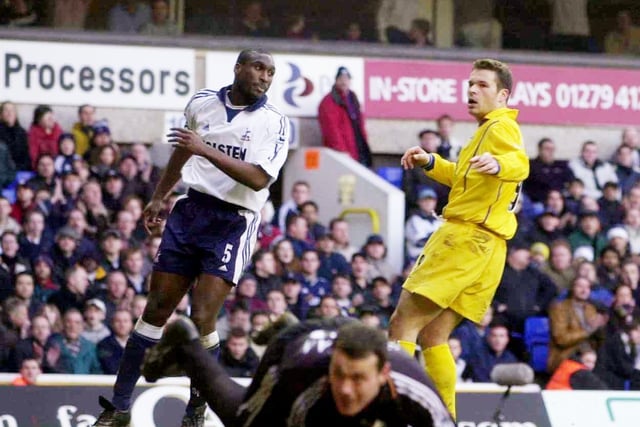 Mark Viduka sees his shot blocked by Tottenham Hotspur goalkeeper Neil Sullivan.