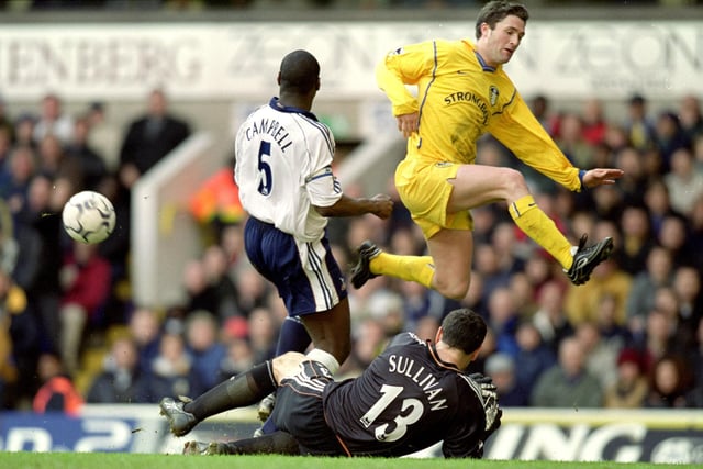 Striker Robbie Keane is foiled by Tottenham Hotspur goalkeeper Neil Sullivan.