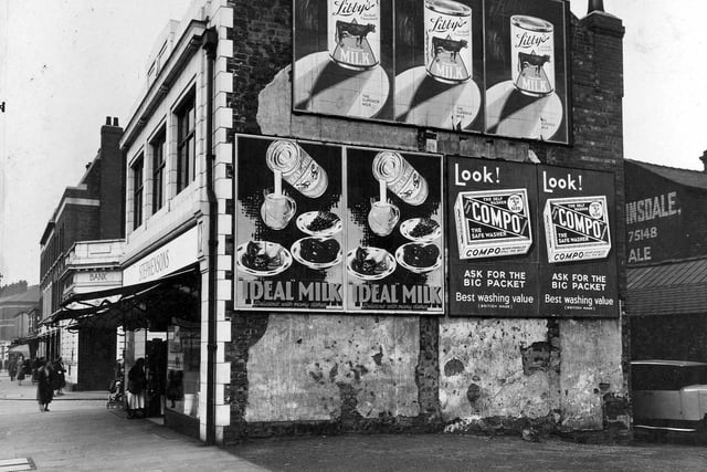 The gable end of Stephenson's shop showing advertisements for Ideal Milk, Libby's Evaporated Milk and Compo Washing Powder in September 1934.