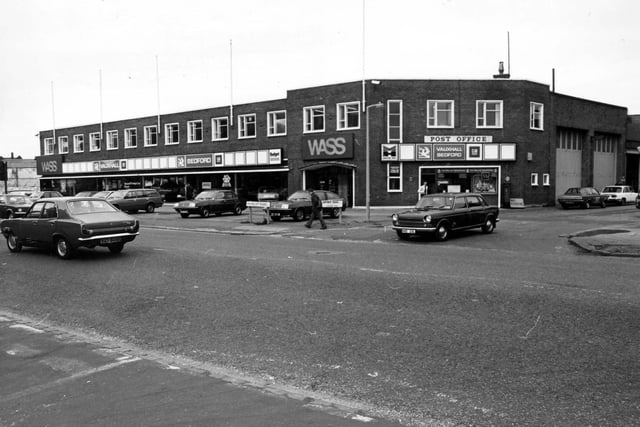 WASS garage, car showroom on Hunslet Road pictured in March 1980. Dealers in Vauxhall and Bedford vehicles. To the right is a shop which includes a post office facility. WASS was a division of the Wallace Arnold group.