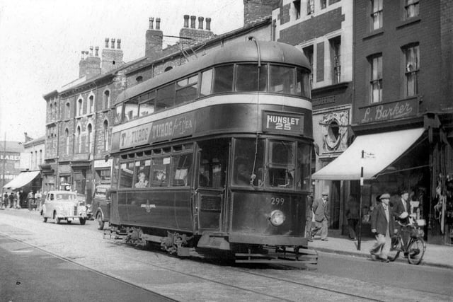 An undated photo showing tram no.299 travelling along Hunslet Road on route no.25 to Hunslet. Shops visible include, to the right, L. Barker, draper, then Hunslet sub-post office. Tram 299 was an ex-Southampton one acquired by Leeds in 1949.