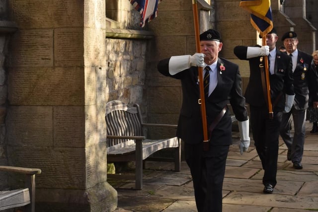 Paying their respects for the fallen. Picture by Ken Geddes
