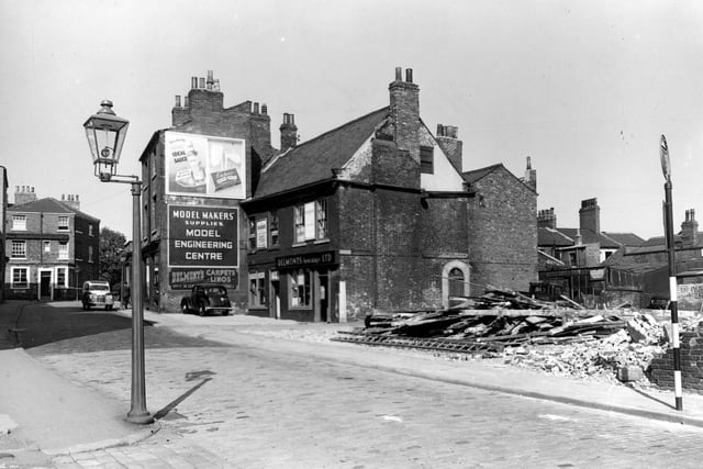 Wade Lane in September 1953. View looking north east at east-south-east side and number 42. Delmonts Furnishings Limited occupies two brick buildings.