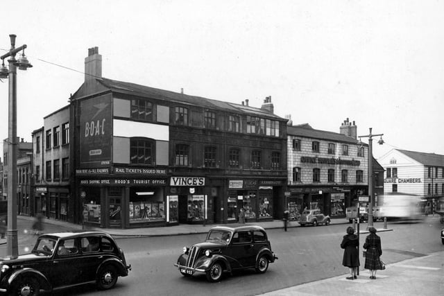 Park Lane at the junction with Park Cross Street in April 1953. Shops include; Hood's Tourist Office, Vince's Shoe Shop, Crockatt's Dryers and Cleaners, H. Lucas - Tobacco among others.