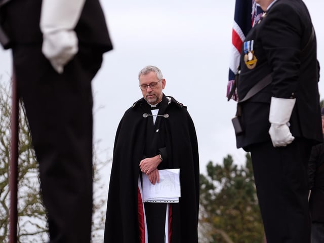 Reverend Richard Walker leading prayers
