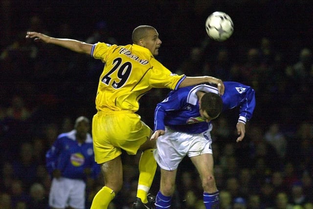 Rio Ferdinand heads clear on his Leeds United debut under pressure from Leicester City's Muzzy Izzet during the Premiership clash at Filbert Street in December 2000.