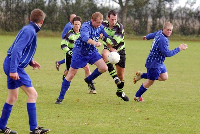 Who are the players in this local football match?
