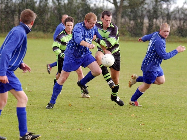 Who are the players in this local football match?