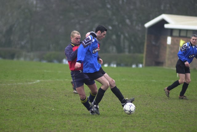 Who is battling it out for possession in this photo?
