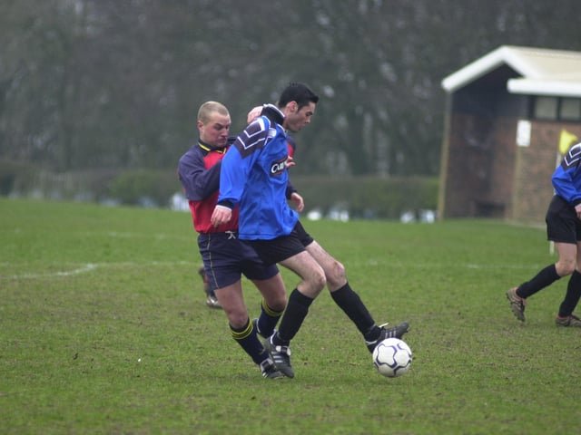 Who is battling it out for possession in this photo?