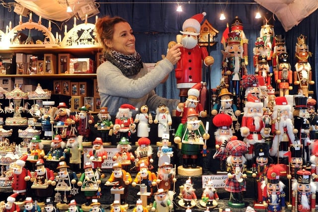 The Christkindelmarkt in Leeds took place in Millennium Square on November 9 2018 - Elodie Desrousseaux is pictured organising her stall of festive decorations.