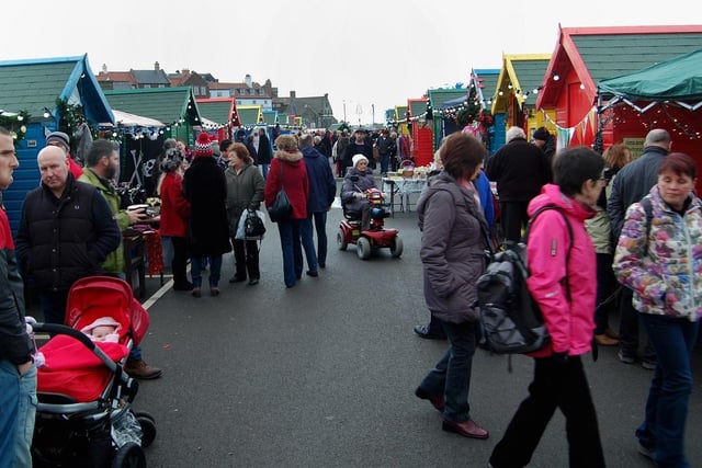 Crowds browsing the Whitby Christmas Market in 2014.