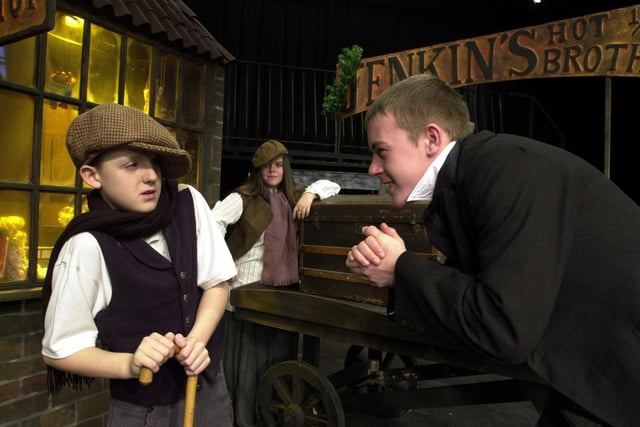 Cockburn High School were preparing to stage its Christmas production of Scrooge. Pictured in the lead role is Mark Kent (right) with Thomas Duggan as Tiny Tim and Carla Watts portraying Tom Jenkins.