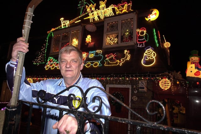 This is Ken Burton outside his home on York Road which he decorated with Christmas lights to raise money for Martin House Children's Hospice.