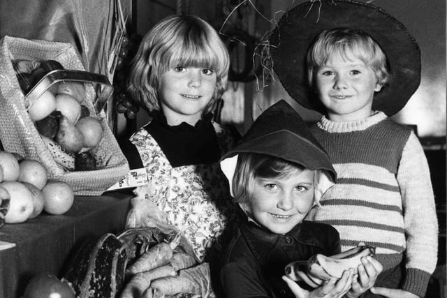 Fleetwood youngsters got their gifts ready for the harvest festival at Blakiston Infants School. From left Amanda Walderman, Helen Brickman and Andrew Eaton, October 5 1979