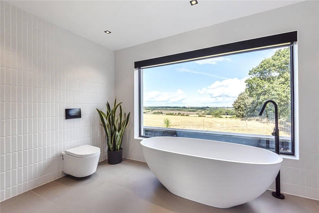 The family bathroom is simple, sleek and very modern. The best part however, is the standalone bathtub which benefits from amazing views over the countryside.