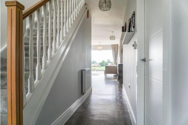 Enter into the spacious family home and into the hallway.