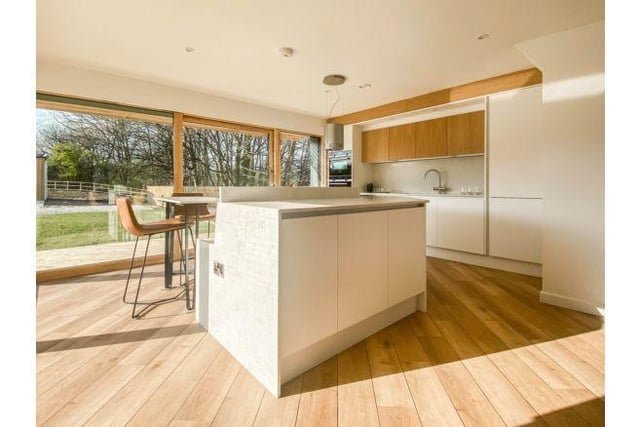 Towards the back of the house is the stunning and modern open plan living space.
