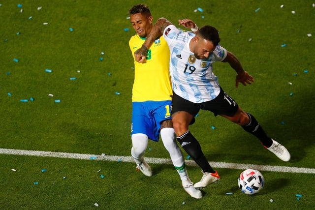 Raphinha is caught by the trailing elbow of Nicolas Otamendi in the Argentina box.
