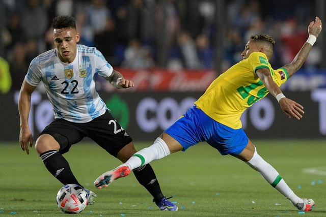 Lautaro Martinez just about gets away from the Whites winger.