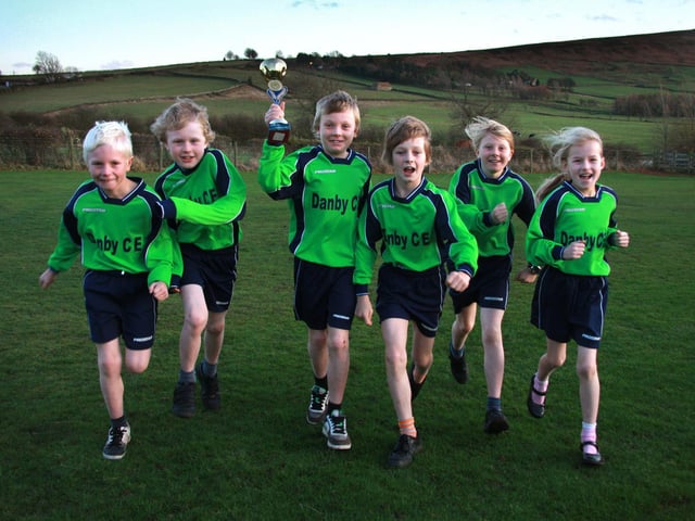 Cross country runners from Danby School with their trophy.