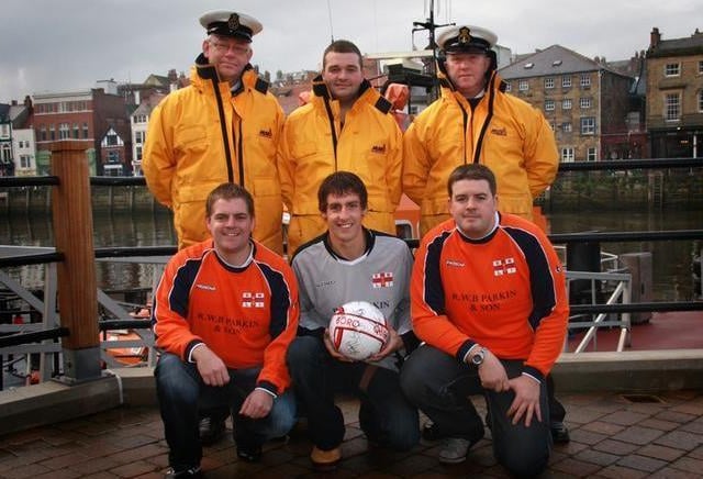 Members of the Whitby RNLI football team gather for a pre-match photo.