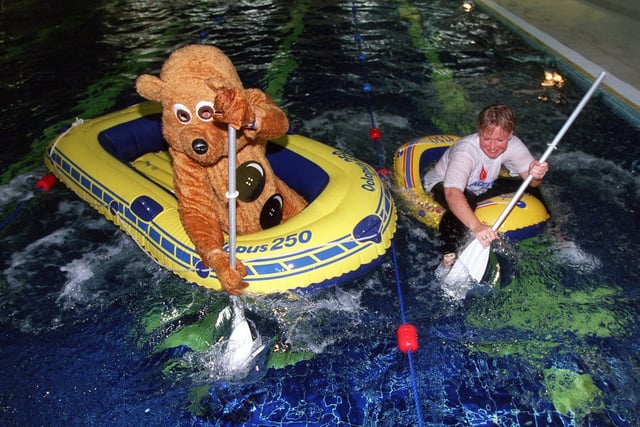 Pudsey Bear, alias Rob Jowsey, takes to the water for a race with club manager Bernie Hawkins during a Children in Need fundraiser at Virgin Active health club, on Kirkstall Road in November 1999.